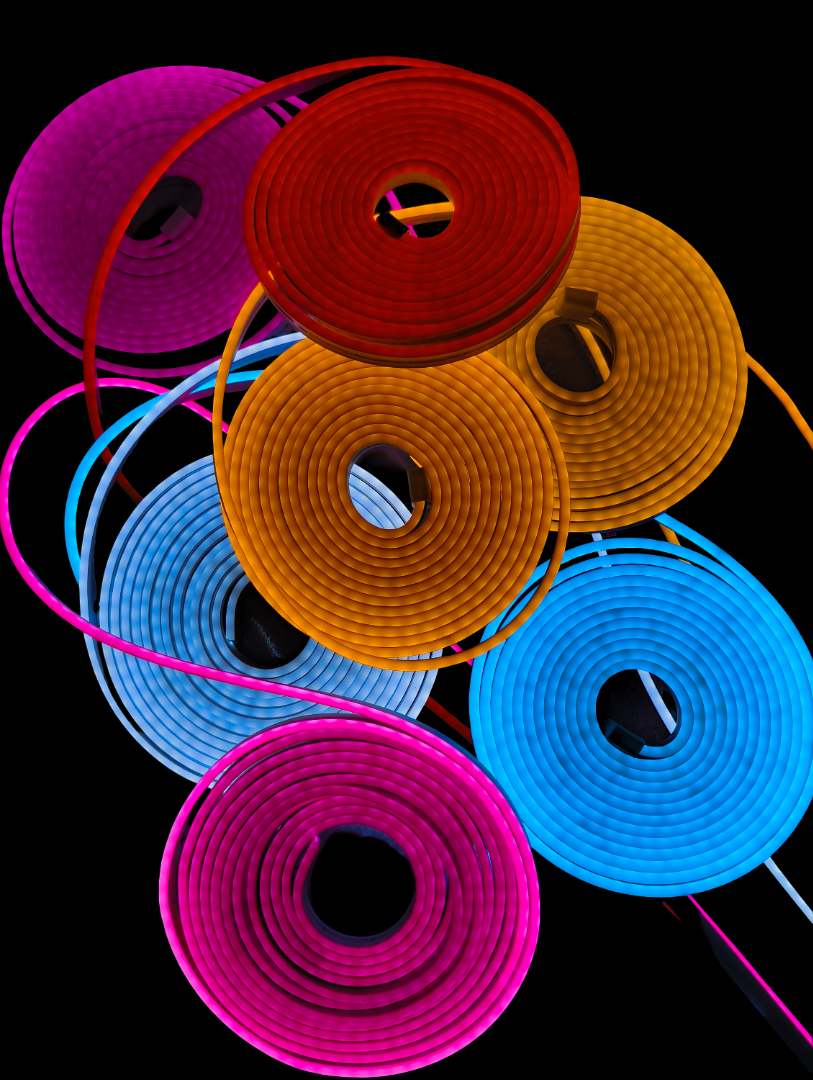 Colorful LED strip lights in various colors on a black background
