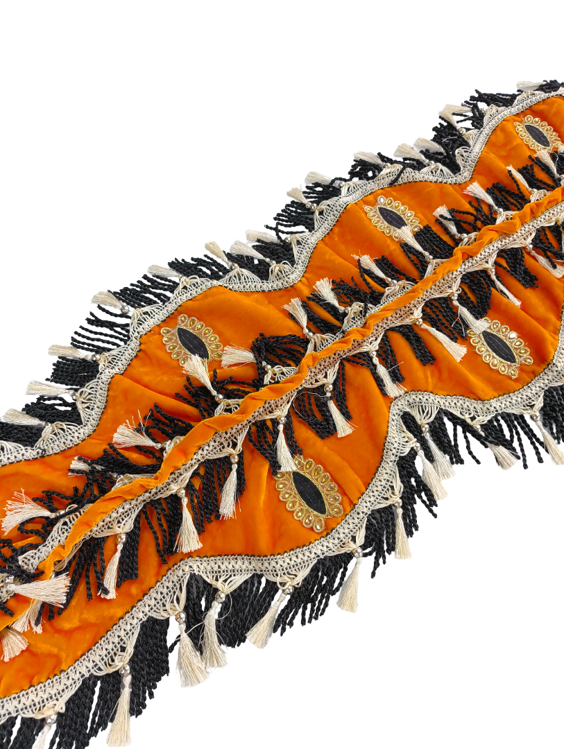 Decorative orange fabric with black and white patterns on a white background