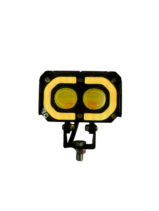LED work light with dual yellow lenses on a white background